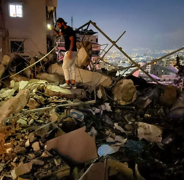Israel Strikes Beirut Suburbs Targeting Hezbollah Commander, Threatening Ceasefire