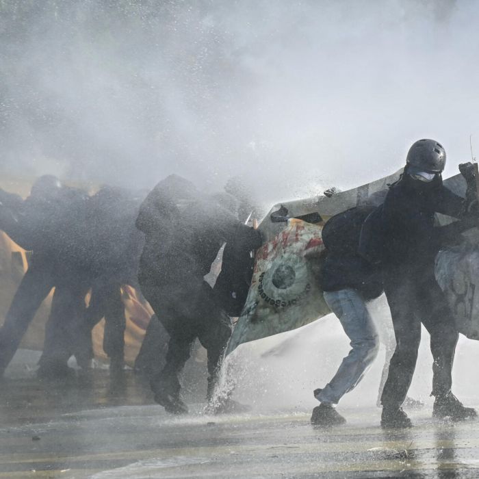 Geneva G7 Protest Turns Violent as Police Deploy Tear Gas and Water Cannon