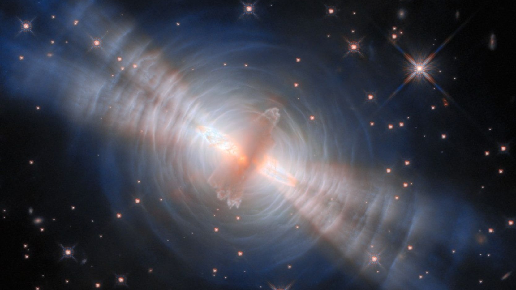 a-cosmic-swarm-hubble-captures-thousands-of-galaxies-and-the-bending-of-ancient-light