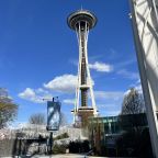 Two Men Vault the Space Needle's Glass Barrier